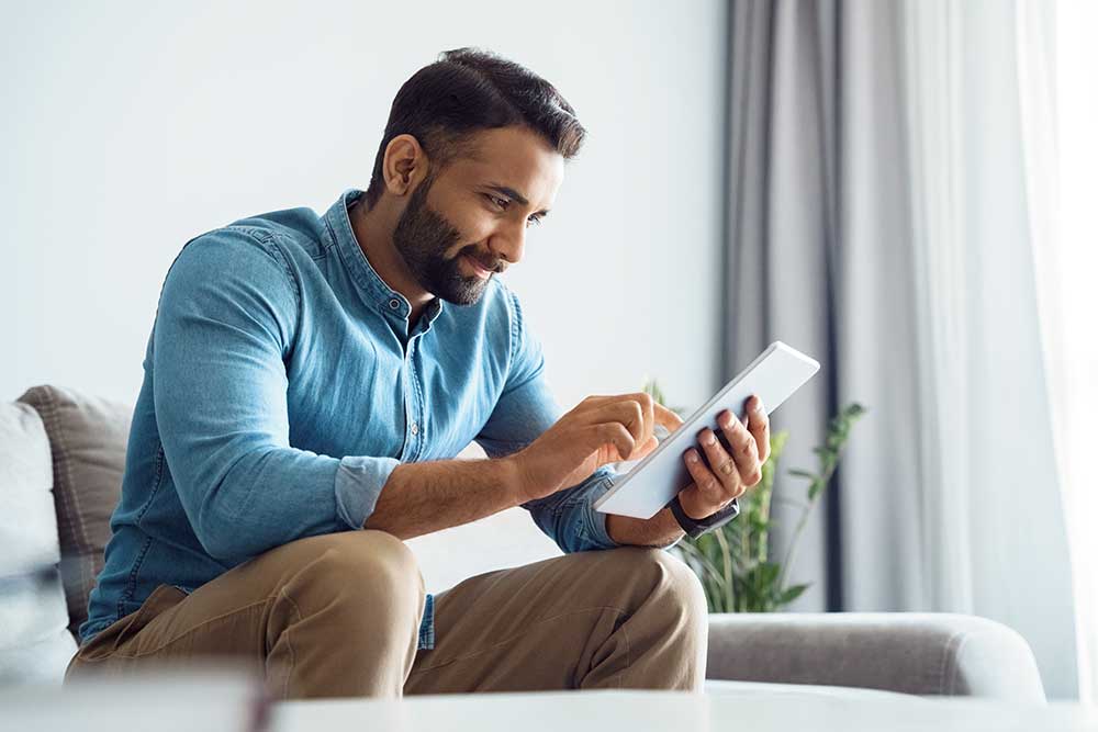 Man reading free guide about uninsured motorist coverage